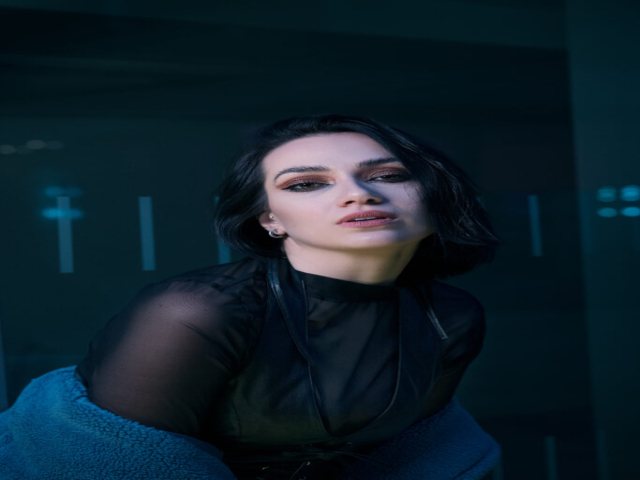 Images has a futuristic theme of dark blues, featuring a model in centre of image