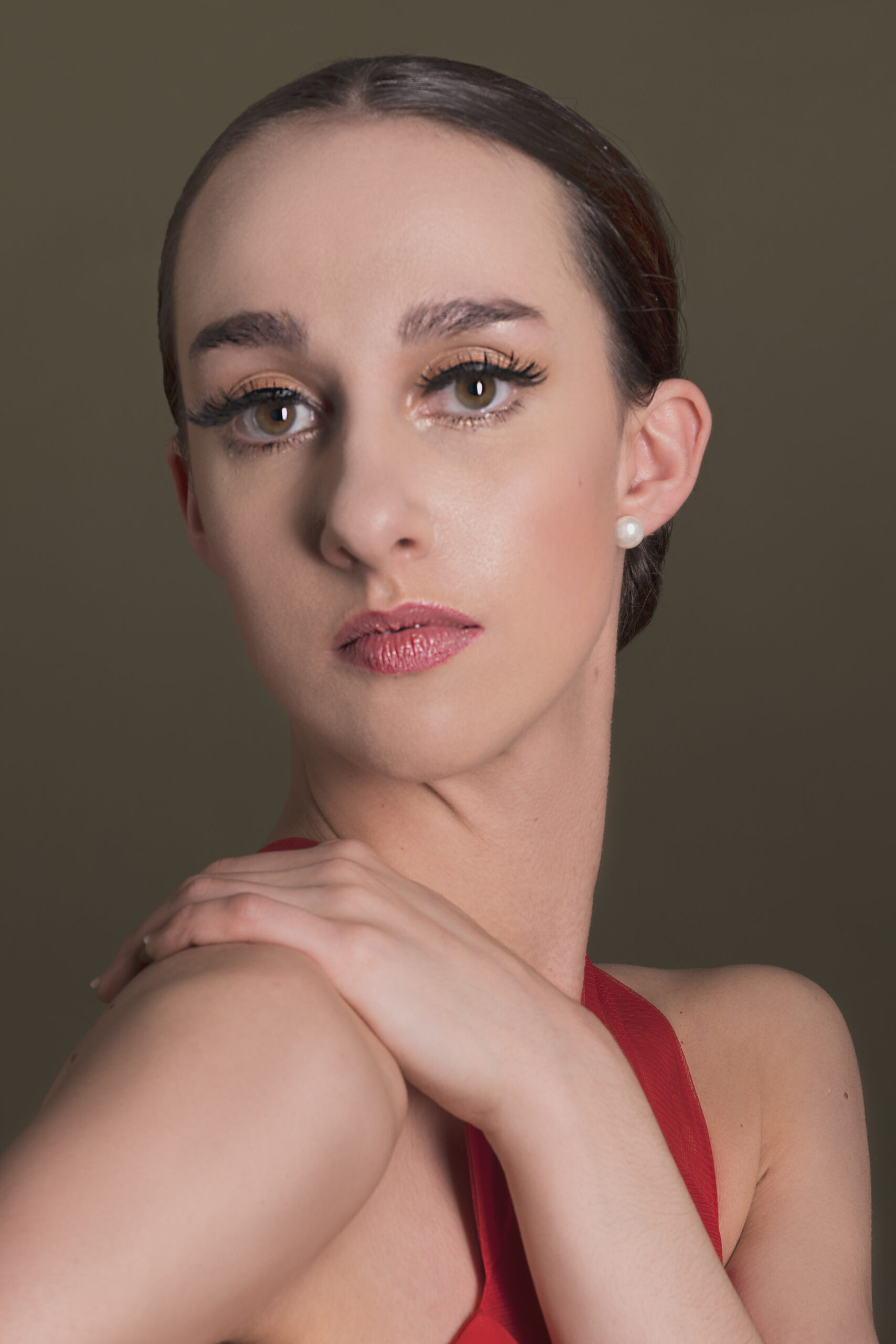 Image of Erica, a ballerina. A portrait of Erica looking directly at the camera