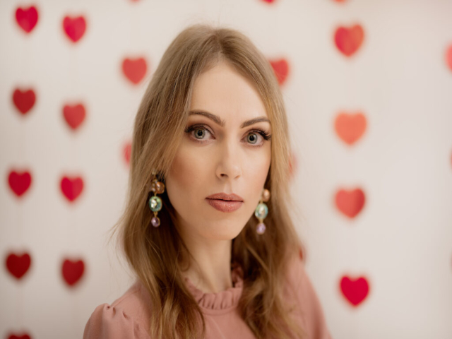 Image of Alona, with a Valentine's Day Theme, featuring white background with red hearts