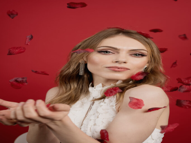 Image of Alona, with a Valentine's Day Theme. With red rose petals falling/